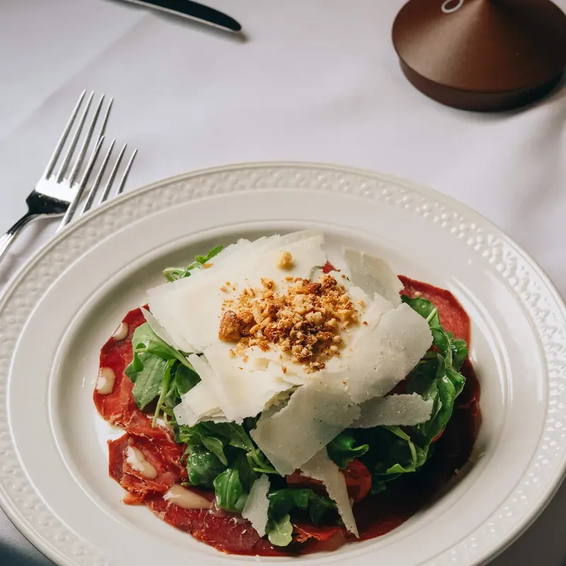 Beef carpaccio with arugula and shaved parmigiano