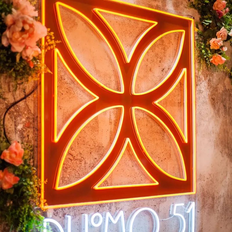 The Duomo 51 sign framed in flowers